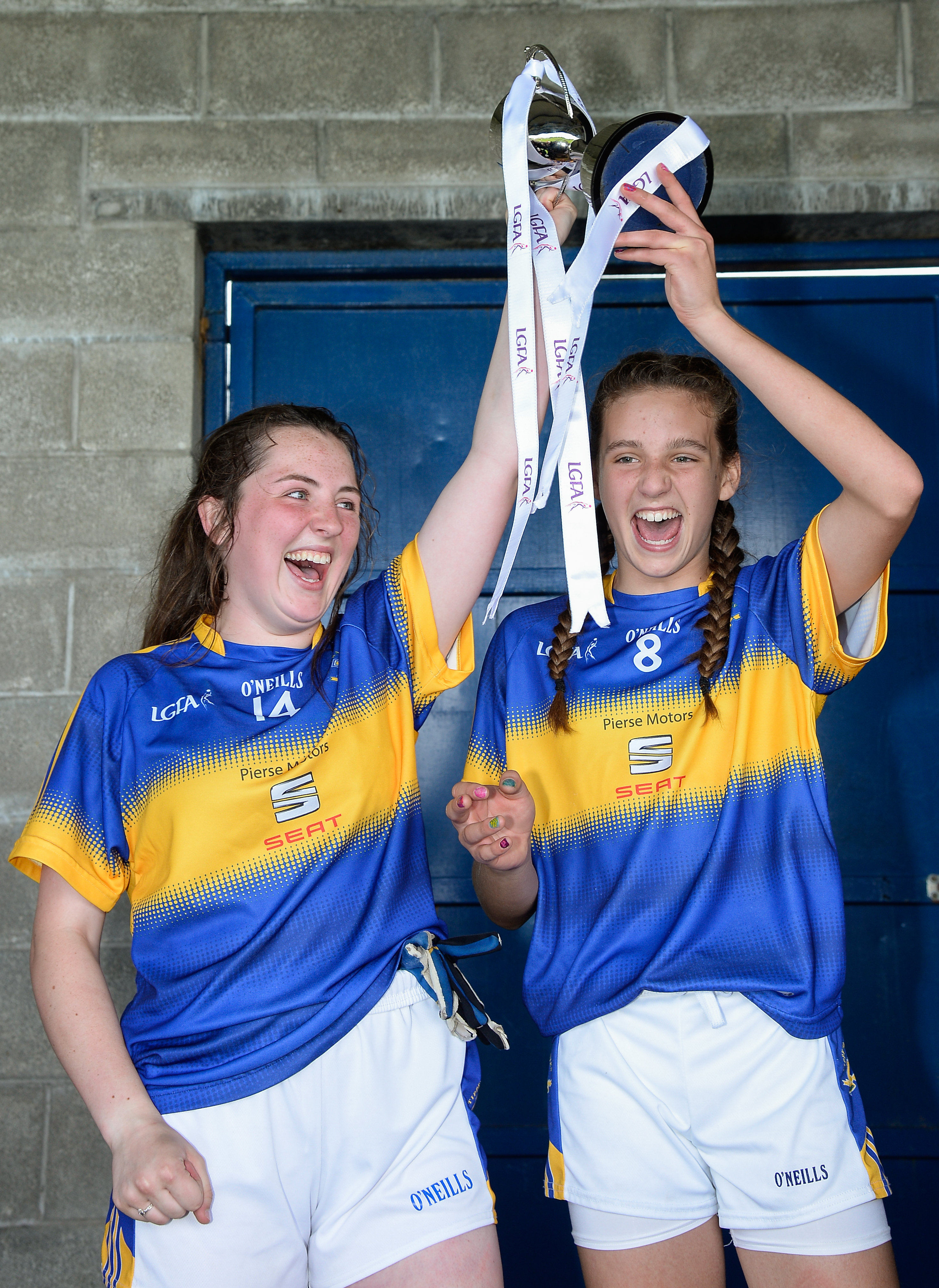 2 July 2016; Tipperary joint captains Ciara Dwan, left, and Ellen Moore lift the cup after defeating Meath in the All-Ireland Ladies Football U14 'B' Championship Final at McDonagh Park in Nenagh, Co Tipperary. Photo by Ray Lohan/SPORTSFILE *** NO REPRODUCTION FEE ***